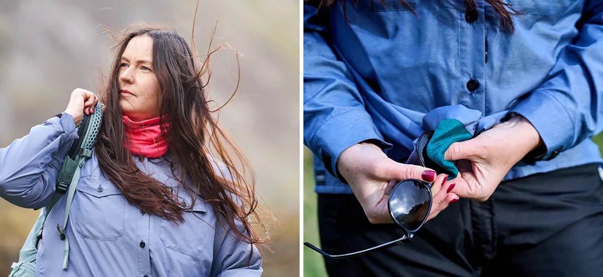 Woman wearing blue outdoors shirts and using the features of the shirt to clean her shirt